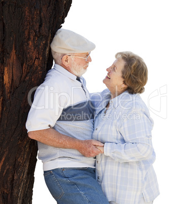 Happy Senior Couple Leaning Against Tree on White