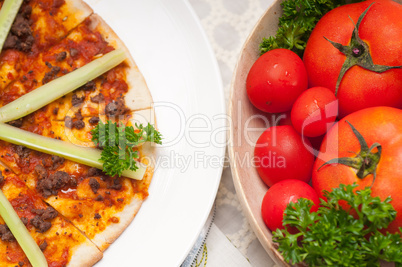 Turkish beef pizza with cucumber on top