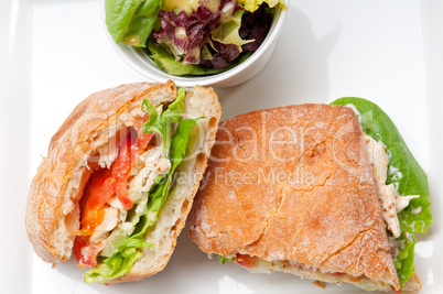 ciabatta panini sandwich with chicken and tomato