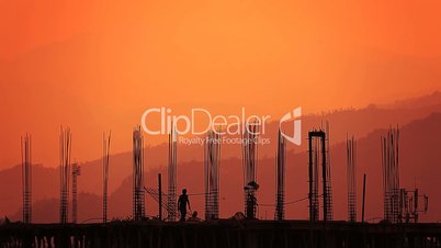 Silhouette of the worker and the building.