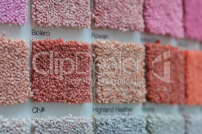 carpet samples in shades of red, orange and pink