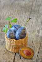 basket with plums