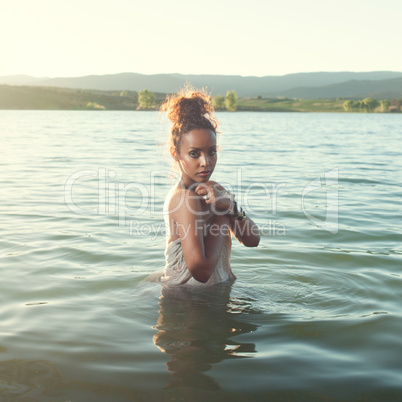 beautiful woman waist high in water