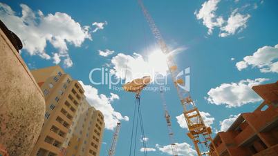crane lifts building materials to the construction of multi-storey buildings