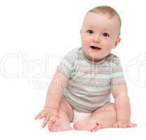 beautiful laughing happy baby boy sitting on white bed