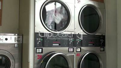 Work of the Front-loading washing machine at laundromat