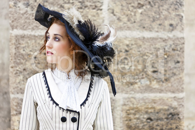 Old-fashioned dressed woman with wandering gaze