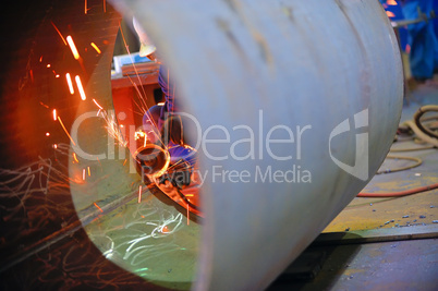 naval welder with protective mask welding metal