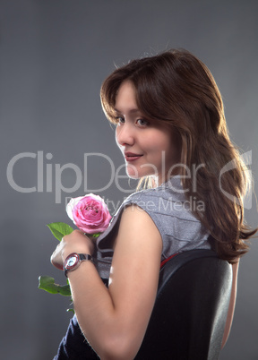 beautiful young girl with a pink rose