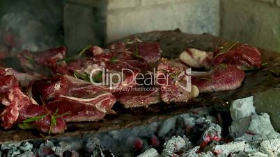 grilling mutton meat on the coals