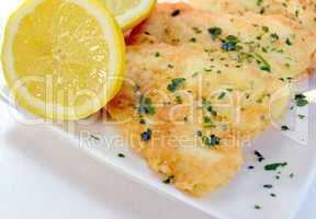 Fish cooked with parsley and lemon