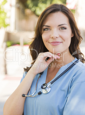 Young Adult Woman Doctor or Nurse Portrait Outside
