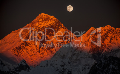 Peak Everest on a sunset in a full moon.