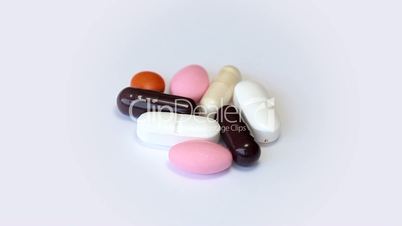 Rotating pills on a white background