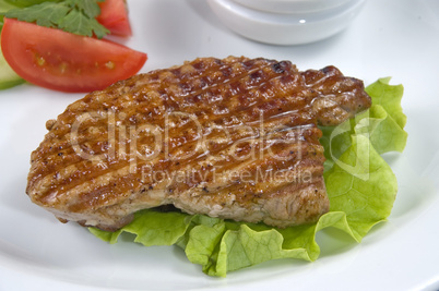 piece of fried meat with vegetables.