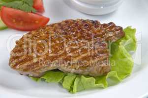 piece of fried meat with vegetables.