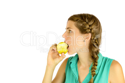 Girl taking a bite of an apple.