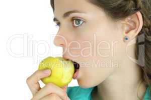 Girl taking a bite of an apple.