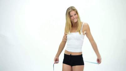 HD1080 Slim young girl measuring her belly and is happy. Version 1