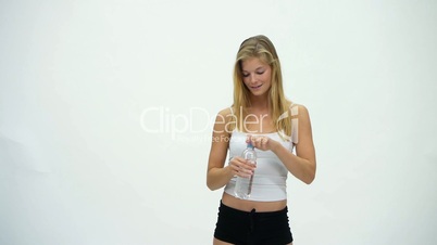 HD1080 Slim fitness blond girl enjoying bottle of water. Version 2