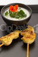 Chicken skewers and bowl
