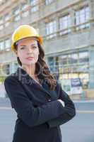 Portrait of Female Contractor Wearing Hard Hat at Construction S