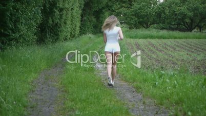 HD1080p Young attractive athletic woman jogging outdoor.