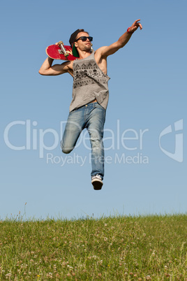 man with a skateboard pointing and leaping