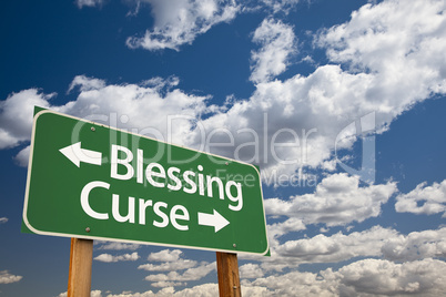 Blessing Curse Green Road Sign and Clouds