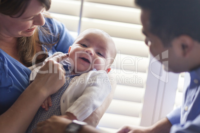 Mixed Race Couple Enjoying Their Newborn Son