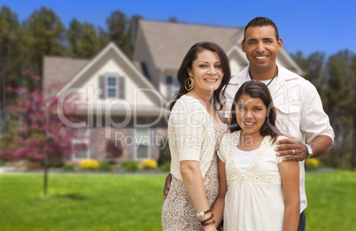 Small Hispanic Family in Front of Their Home