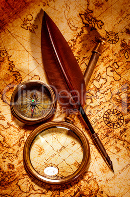 Vintage magnifying glass lies on an ancient world map