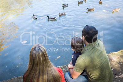 Mixed Race Mother and Father with Son at the Pond