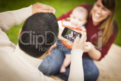 Happy Mixed Race Parents and Baby Boy Taking Self Portraits