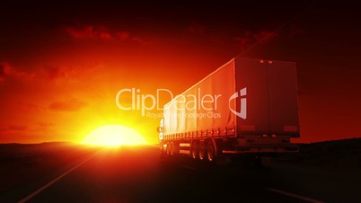 Truck on highway at sunrise