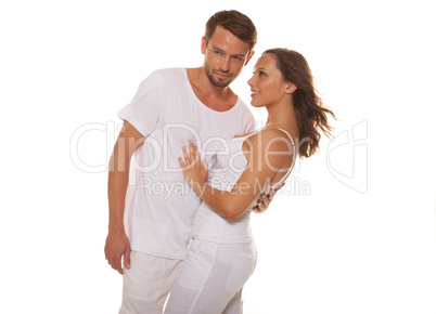 happy couple embracing wearing white