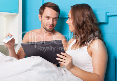 young couple shopping online from home