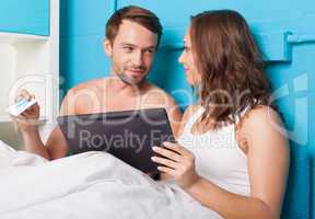 young couple shopping online from home