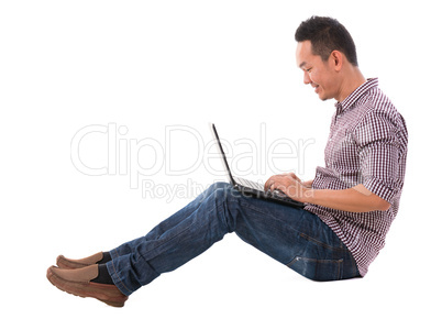 Asian man using laptop