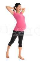 Asian pregnant woman doing yoga stretching