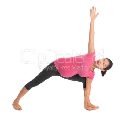 Asian pregnant yoga stretching.