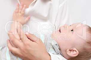 baby in mother's hands