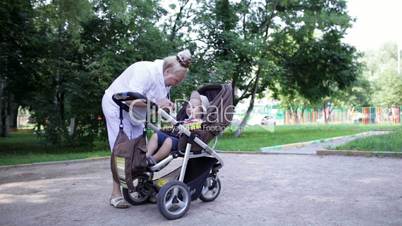 Granny playing with her grandson in the yard