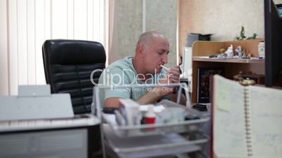 Businessman smoking in the office