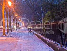 Georgian houses in traditional winter snow scene at nightime