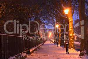 Georgian houses in traditional winter snow scene at nightime