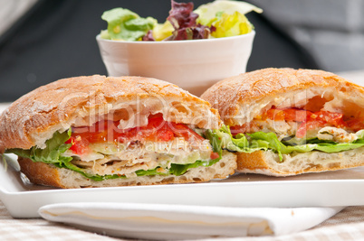 ciabatta panini sandwich with chicken and tomato