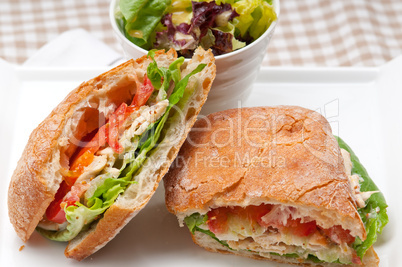 ciabatta panini sandwich with chicken and tomato