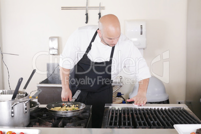 professional chef cleaning the kitchen