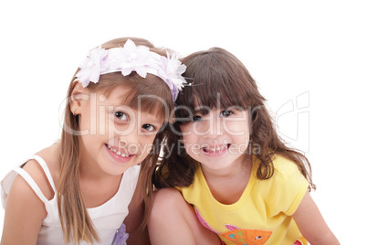 Two little girls, isolated over white